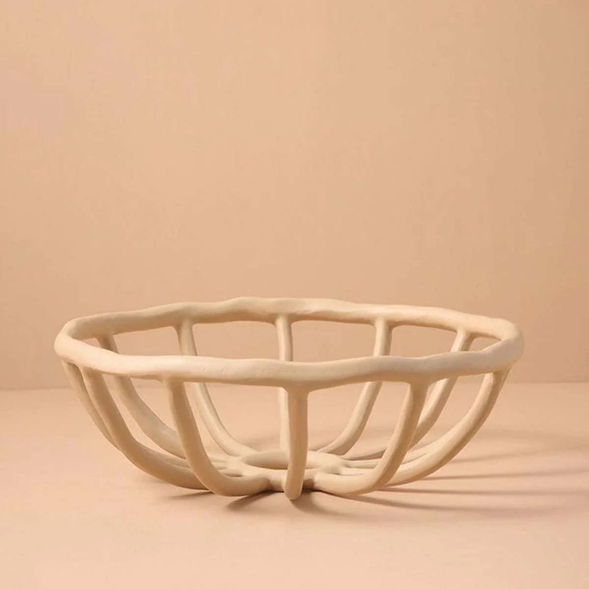 Elegant and Sculpted Resin Fruit Bowl for a Refined Presentation - Image 9